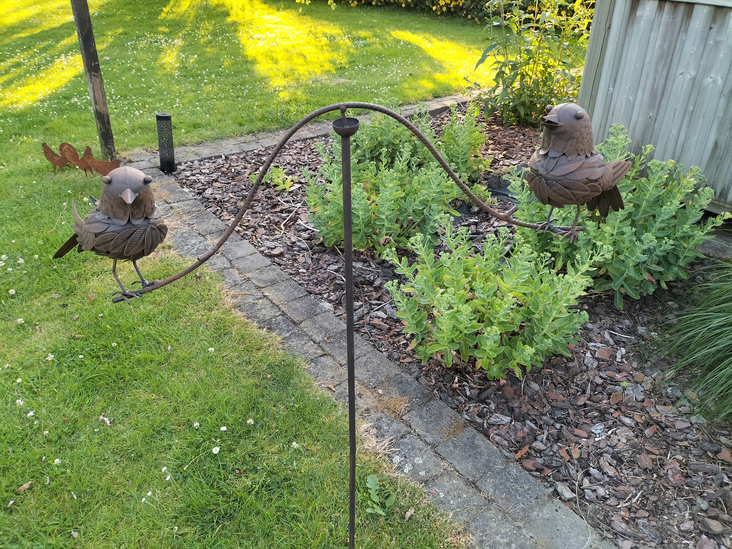 Tuinsteker balancerende vogels